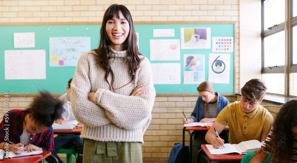 Canvas Prints Just another day being a teacher. Portrait of a cheerful young teacher giving class to a group of students inside of a school during the day.