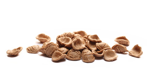 Orecchiette pasta pile isolated on white, side view