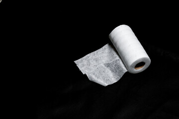 white textile roll  on black backgroung 