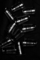 disposable plastic cup  with side light , close up in black background.