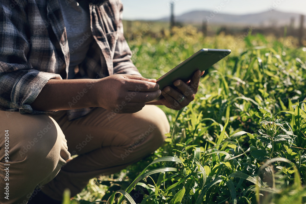 Poster crop monitoring made simple with smart apps. an unrecognisable man using a digital tablet while work
