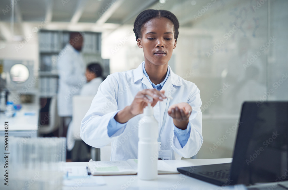 Poster The only bacteria I want is under the microscope. a scientist disinfecting her hands while conducting research in a laboratory.