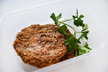 Two meat patties on a white plate. Meat breakfast.