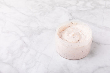 Body cream. Moisturizing and nourishing body cream with shea butter.Natural cosmetics on a marble background.Place for text.