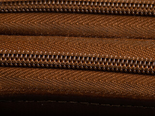 Close up large format file of a zipper from a wallet