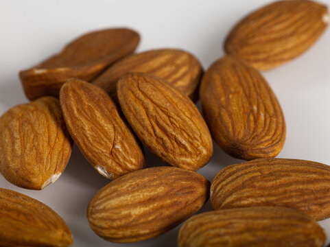 High resolution close up shot of almonds on white background