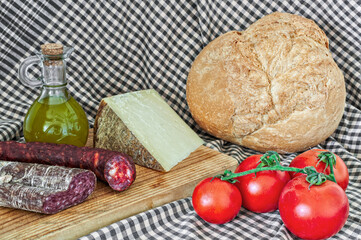 Spanish Delights: A Rustic Still Life of Pa amb Tomàquet, Cheese, Chorizo and More