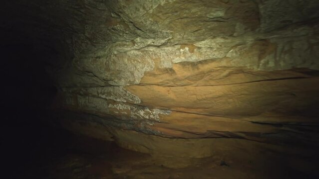steadicam shot of walls and ceiling of an underground sandstone cave