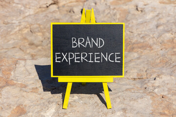 Brand experience symbol. Concept words Brand experience on black chalk blackboard on a beautiful...
