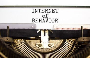 Internet of behavior symbol. Concept words Internet of behavior on white paper typed on old retro typewriter on beautiful white background. Business Internet of behavior concept. Copy space.