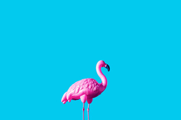 pink inflatable flamingo over blue background, vacation concept. Generative Ai