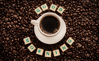 You cant start the day without a cuppa. Closeup shot of a cup of coffee surrounded by block letters...