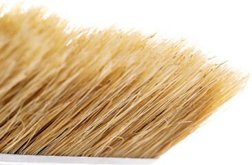 natural paint brush on a white background with a wooden handle