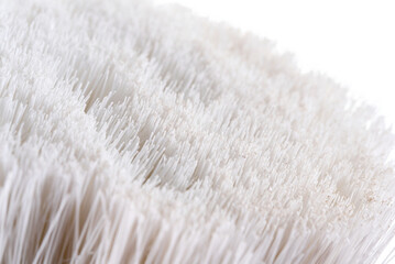 natural paint brush on a white background with a wooden handle