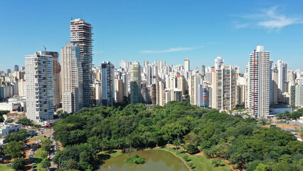 Fantastic aerial view of Vaca Brava Park with tropical nature, a lake and modern residential...