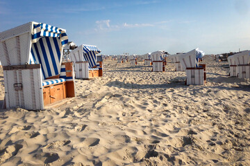 Scenic view of beach in St. Peter Ording, Germany with empty beach chairs in the morning