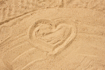Fototapeta na wymiar Heart picture on a sand beach in summer