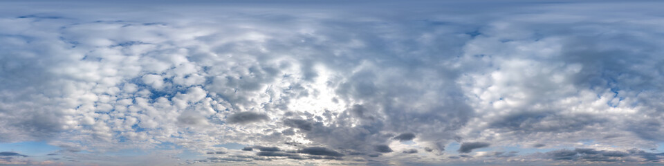 overcast blue sky with cumulus clouds as seamless hdri 360 panorama with zenith in spherical...