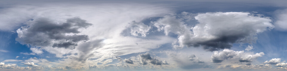 overcast blue sky with cumulus clouds as seamless hdri 360 panorama with zenith in spherical...