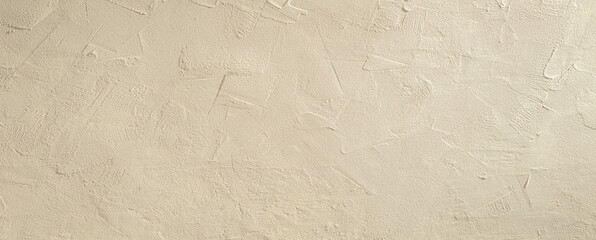 Light beige rough grainy stone or plastered wall texture background