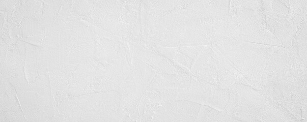 White rough grainy stone or plastered wall texture background