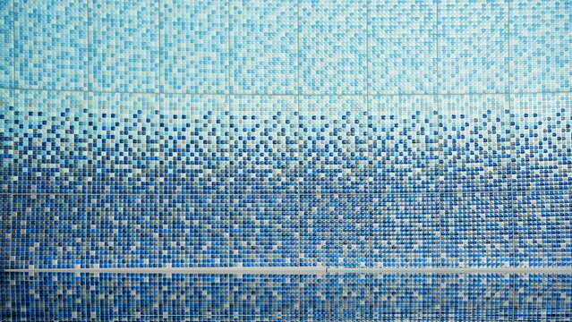 Blue ceramic tiled wall of swimming pool under water surface. Modern bathroom mosaic decoration.