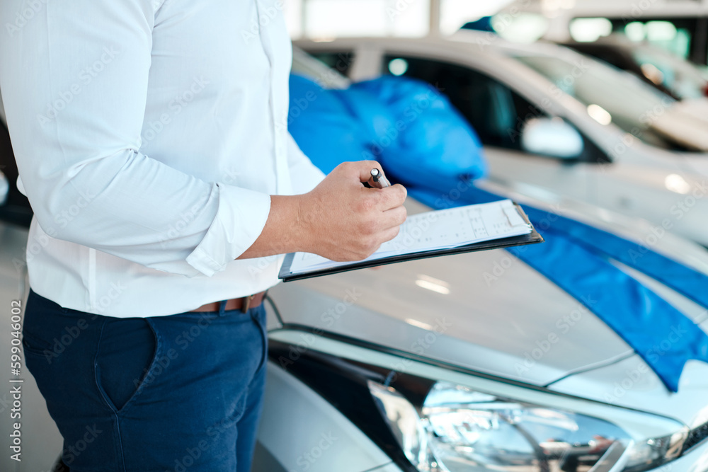 Poster always make sure contracts are in order. a car salesman writing on a clipboard.