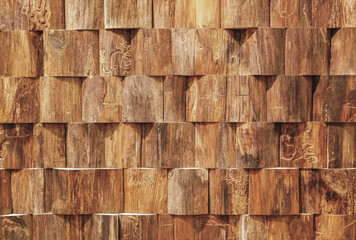 Beautiful wooden blocks wall with texture and rough surface in warm brown tone for background and decoration.                   
