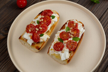 Bruschetta with dried tomatoes and strachatella cheese