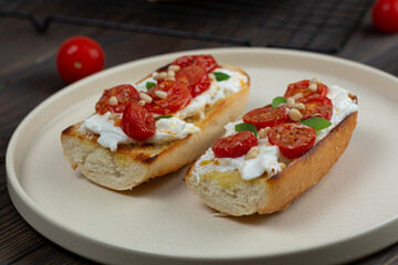 Bruschetta with dried tomatoes and strachatella cheese