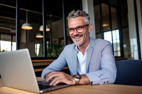 Happy Mature Business Man Executive Manager Looking At Laptop Computer Watching Online Webinar Or Having Remote Virtual Meeting, Video Conference Call Negotiation. Generative AI.