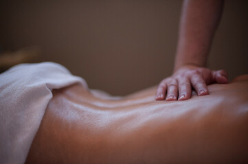 Photographs of massage and bodywork. Male therapist working on female client.  - 599055435