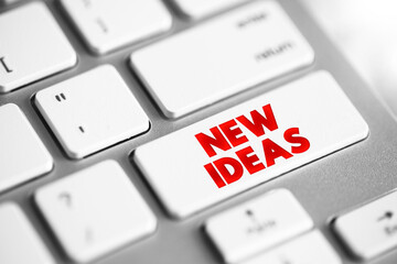 New Ideas text button on keyboard, concept background