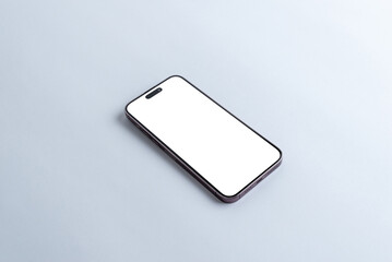 Smartphone with blank white display screen on gray table for app or web page presentation