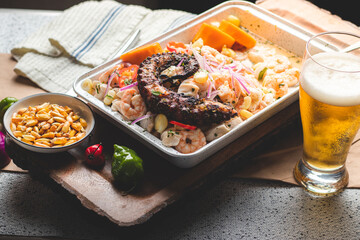 Peruvian traditional food ceviche with fish, red onions, sweet potatoes and red peppers. 