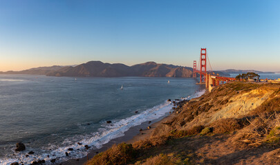 Fototapeta na wymiar Golden Gate Bridge, Fort Point Rock and Golden Gate at Sunset