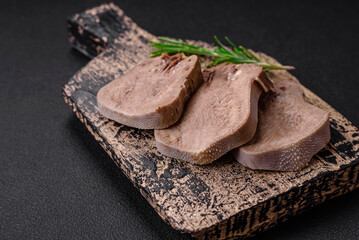 Delicious boiled beef tongue sliced with vegetables and spices
