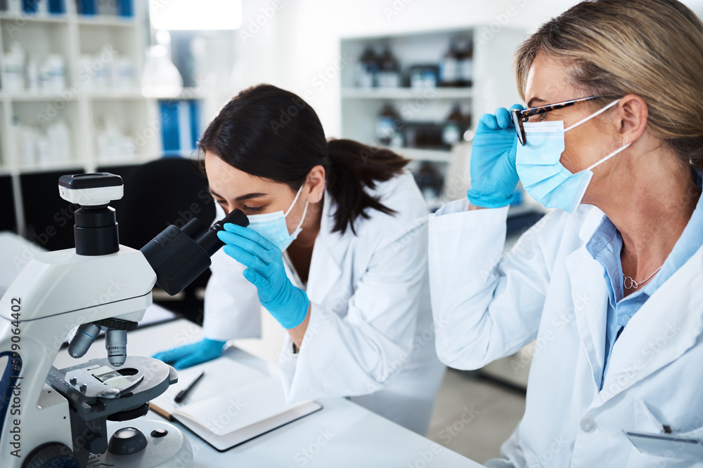 Poster Heading towards the discovery of a new breakthrough. two scientists working together in a lab.