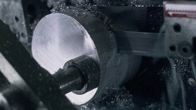 Close up shot of band saw cutting steel pipe and using the coolant liquid. Process of work professional machine for industrial cutting on factory. Concept of manufacturing, production Generative AI