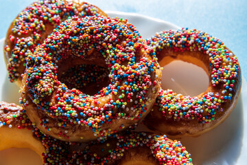Chocolate sprinkle delicious donuts on a blue background...