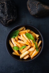 Fresh french fries with salt and greens.