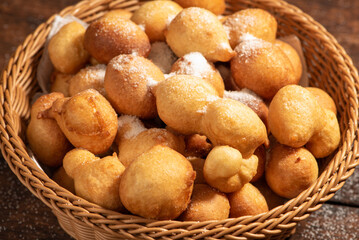 Raincake, basket with raincakes on rustic wood, selective focus.