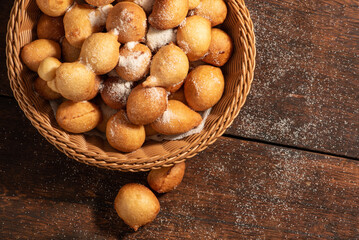 Raincake, basket with raincakes over rustic wood top view, selective focus.