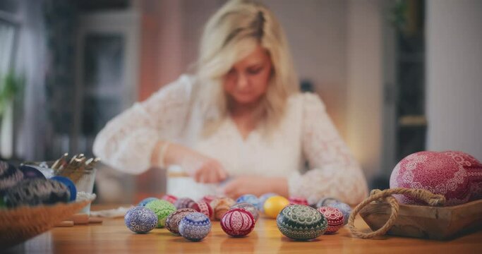 Woman decorating Traditional Easter Eggs Using Old Traditional Technique. Generative AI