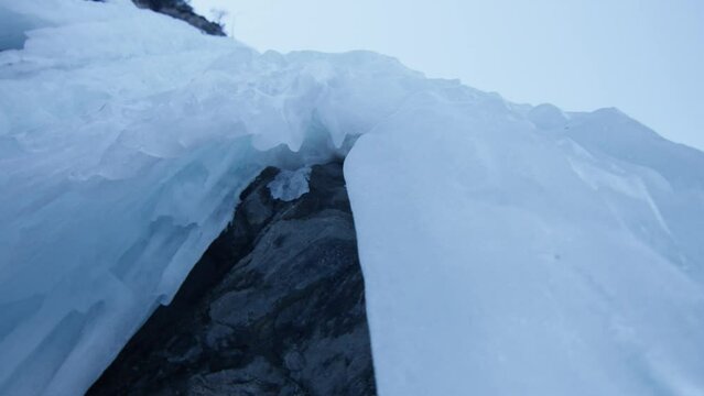 Macro shot of stalactites frozen on a rock, in the Alps, Switzerland