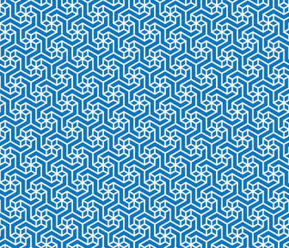 Seamless repeating pattern with geometric small white flowers on a blue background. Retro style ornamental maze. Traditional design.  Graphic textile texture. Vector illustration.