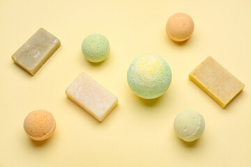 Bath bombs with soap bars on beige background