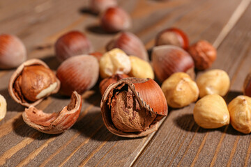 Shelled hazelnuts on wooden background