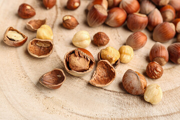 Shelled hazelnuts on wooden background