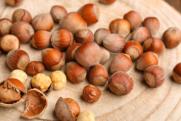 Shelled hazelnuts on wooden background